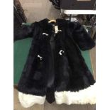 Lady's three quarter length two-tone fur coat