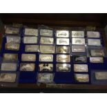 Collection of Beaulieu National Motor Museum silver ingots depicting classic cars,