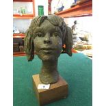 Mid twentieth century sculpture of a girl, signed to base.