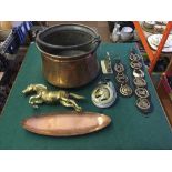 A copper cauldron together with a brass figure of a horse,