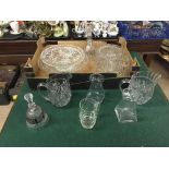 A box of assorted lead crystal jugs, decanters,