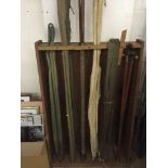 Five assorted fishing rods including an antique two piece cane sea fishing rod,