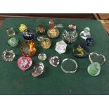 A basket of assorted glass paperweights