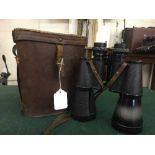 A pair of Omega binoculars in leather case