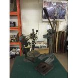 A Wolf drill stand and one other