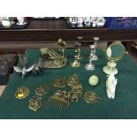 A brass figure, horse brasses, plated candlestick, onyx dressing table mirror,