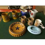 A tray of Newcastle Brown Ale tankards and mugs, Wade whiskey jugs, Rothmans jugs, Henry W.