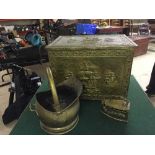 A brass log bin depicting a naval scene, brass bucket and brass coal iron.