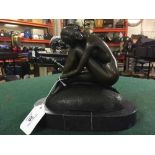 Bronze figure on stone base : a nude study with female crouching on a rock.