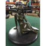 Bronze figure on stone base : nude study of a seated female.