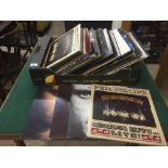 A box of LP records - Phil Collins, Genesis,