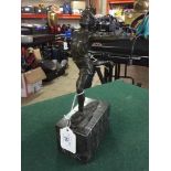 Bronze figure on stone base : the victor crossing the line.