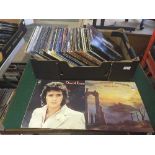 A box of LP records including Scorpions, Status Quo,
