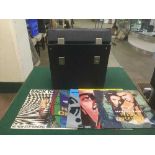 Five cases of LP records and 12" singles including Brian Adams, Carly Simon,