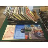 A box of LP records and 12" singles - classic rock, soundtracks,