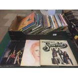 A box of LP records including Lindisfarne, Sting,