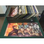 A box of LP records including David Bowie, Springsteen,