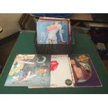 A box of Rolling Stones LP records and 12" singles