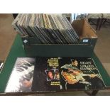 A box and case of LP records including Chris Rea, The Police, Phil Collins,