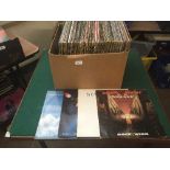 A box of LP records including Status Quo, Foreigner, Rainbow,