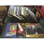 A box of LP records including ZZ Top, ELO,