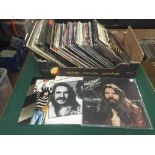 A box of LP records including Eagles, Tom Petty,