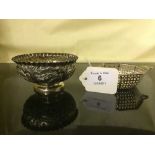 A silver twin handled strainer, together with an Indian silver finger bowl.