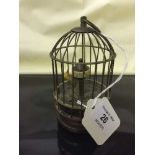 An old metal bird cage clock