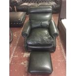 A green leather armchair and footstool