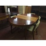 A mid 20th century teak extending table and five chairs