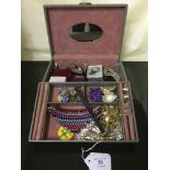 A box of costume jeweller, bracelet, pendants, Votes for Women badge etc.