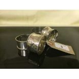 Four silver napkin rings.