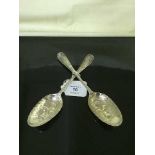 A pair of early nineteenth century silver berry spoons.