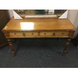 A late nineteenth century ash two drawer side table