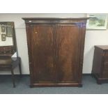 A Victorian mahogany two door wardrobe fitted with two drawers