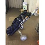 A Browing golf bag with trolley and a set of Hippo irons and Donnay drivers