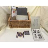 A basket of postcard albums, album of black and white photos of planes,