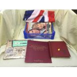 A Union Jack flag on pole and a box of stamp album and stamps, commemorative magazines, scrap book,