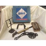 Two part antique fishing rods, a glass Queen wash board, basket of rose sprayer,