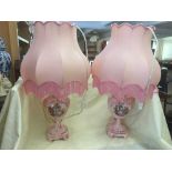 A pair of pink china table lamps and shades