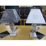 A pair of wooden classical design table lamps with shades