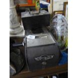 The Vert Paragon cash register together with a small metal safe box.