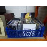 A basket containing a quantity of assorted DVDs including Its a Wonderful Life and CDs including