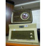 A 1950s Dansette table top record player together with a Bush bakelite cased radio.