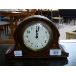 An Victorian inlaid mahogany mantel clock with key.