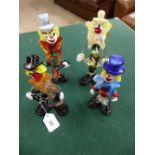 Four Murano glass clowns.