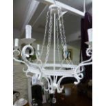 A large painted metal six way ceiling light with glass drops