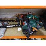 A Black and Decker electric hedge trimmer together with a Performance petrol chainsaw.