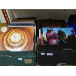 Two boxes containing a quantity of LPs including Michael Jackson, Stevie Wonder, Eric Clapton,