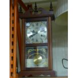 A reproduction Highlands mantle clock together with a cane walking stick and a parasol.